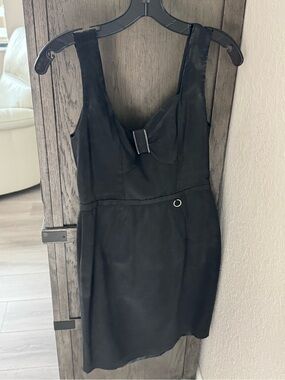 Yoana Baraschi Black Sleeveless Mini Dress with Bow Accent and Ring Detail